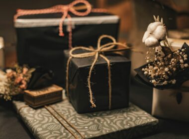 black and brown gift box on white and black floral textile